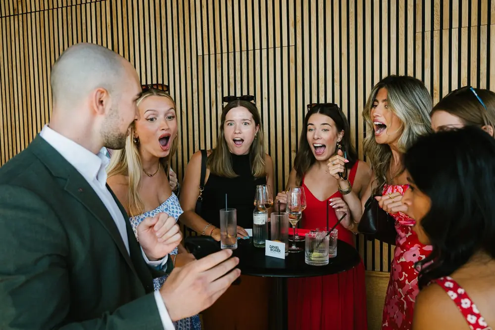 Daniel Bower performing close up magic at a live event