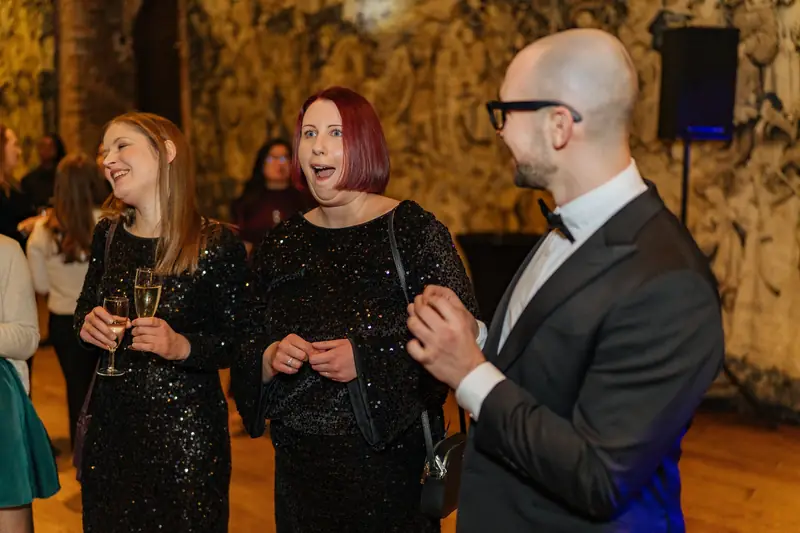 Lotus guests reacting to close up magic at Hatfield House, Hertfordshire