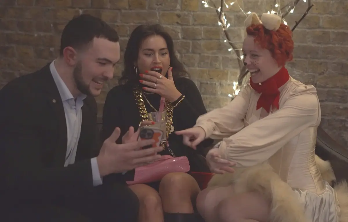 Daniel Bower performing close-up magic for guests at an event