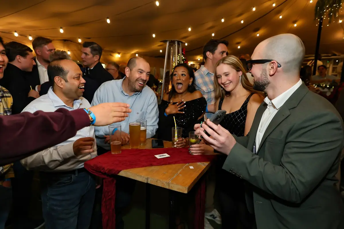 Daniel Bower performing close-up magic for guests at an event