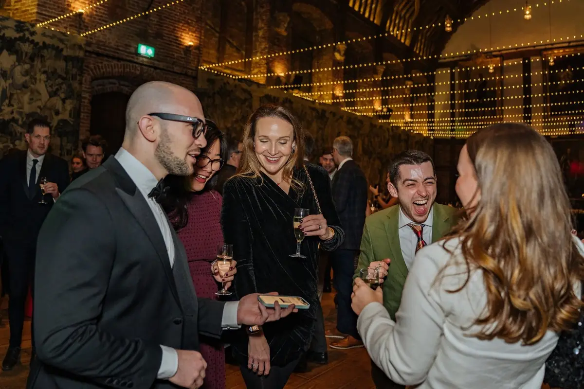 Daniel Bower performing close-up magic for guests at an event